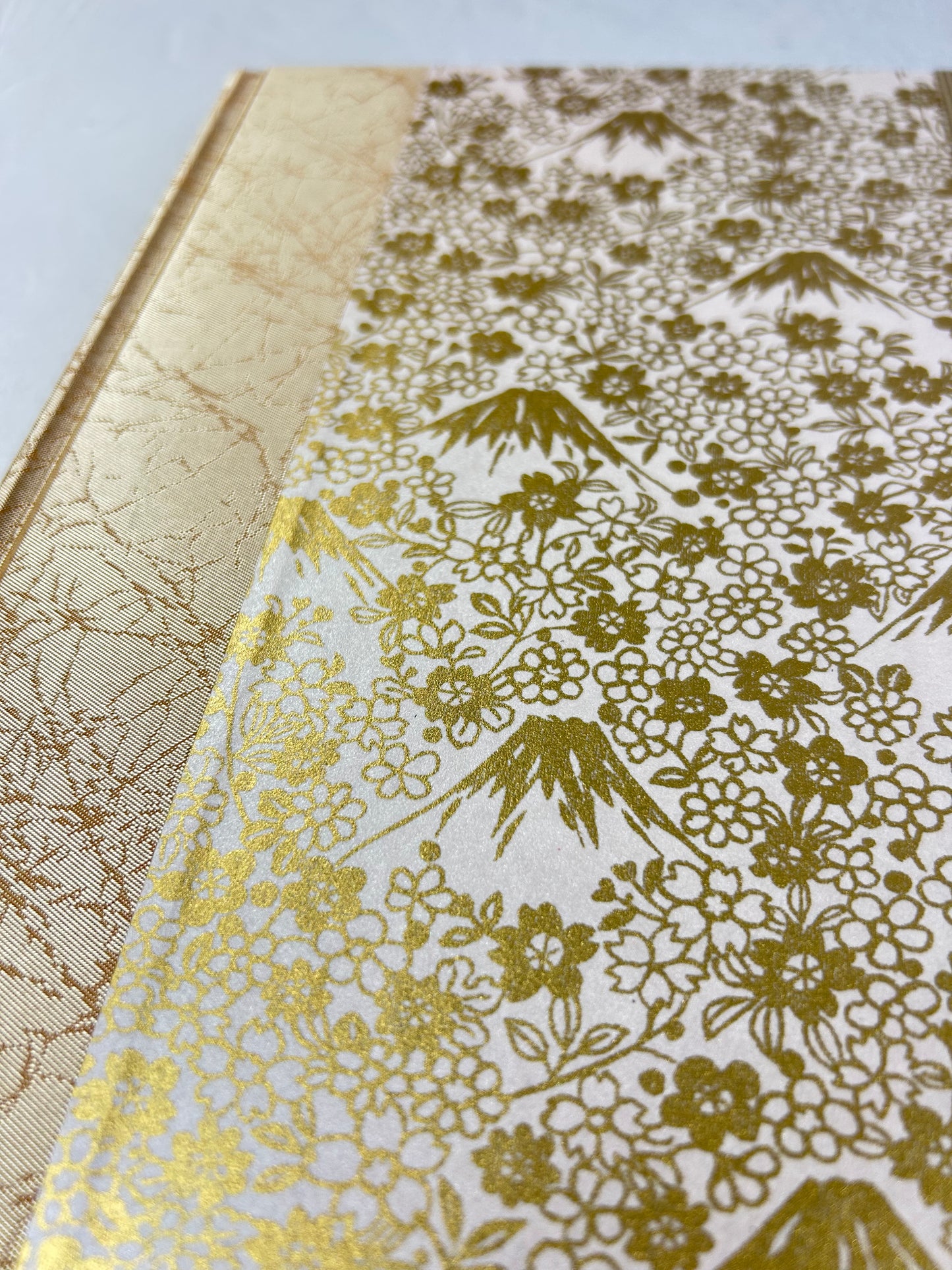A5 160-page Hardcover Journal finished in Creme Satin Japanese book cloth and Gold on White Chiyogami Paper