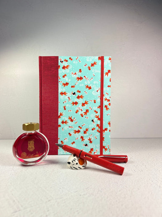 A5 Hardcover Notebook finished in Scarlet Red Japanese Bookcloth and Red/Orange Koi Fish on Aqua Chiyogami Paper