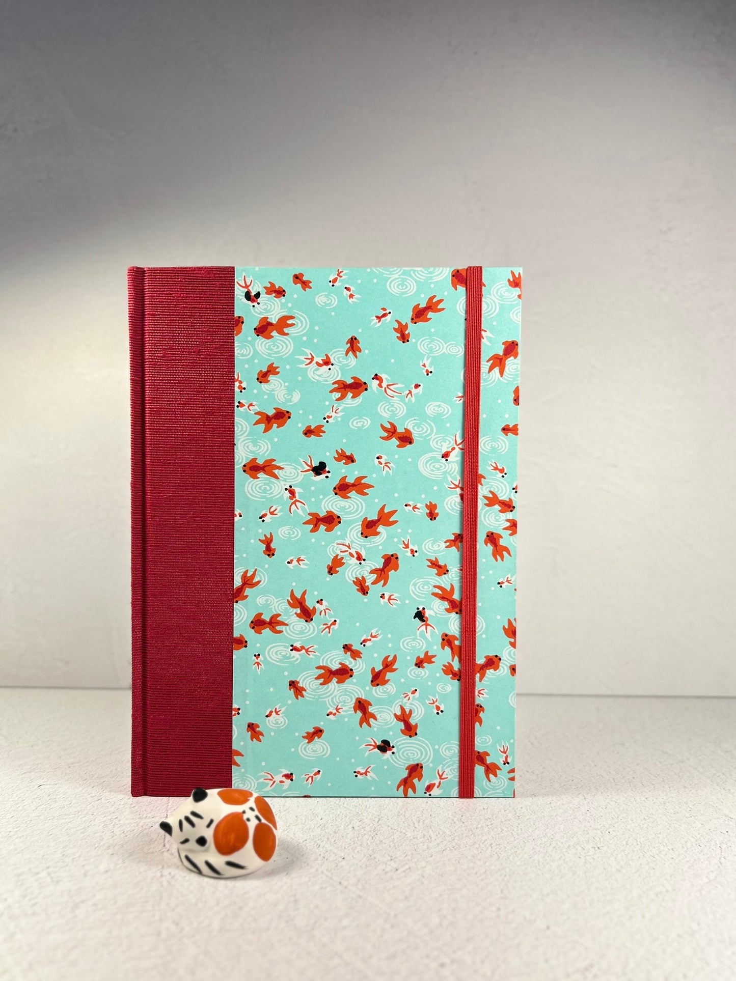 A5 Hardcover Notebook finished in Scarlet Red Japanese Bookcloth and Red/Orange Koi Fish on Aqua Chiyogami Paper