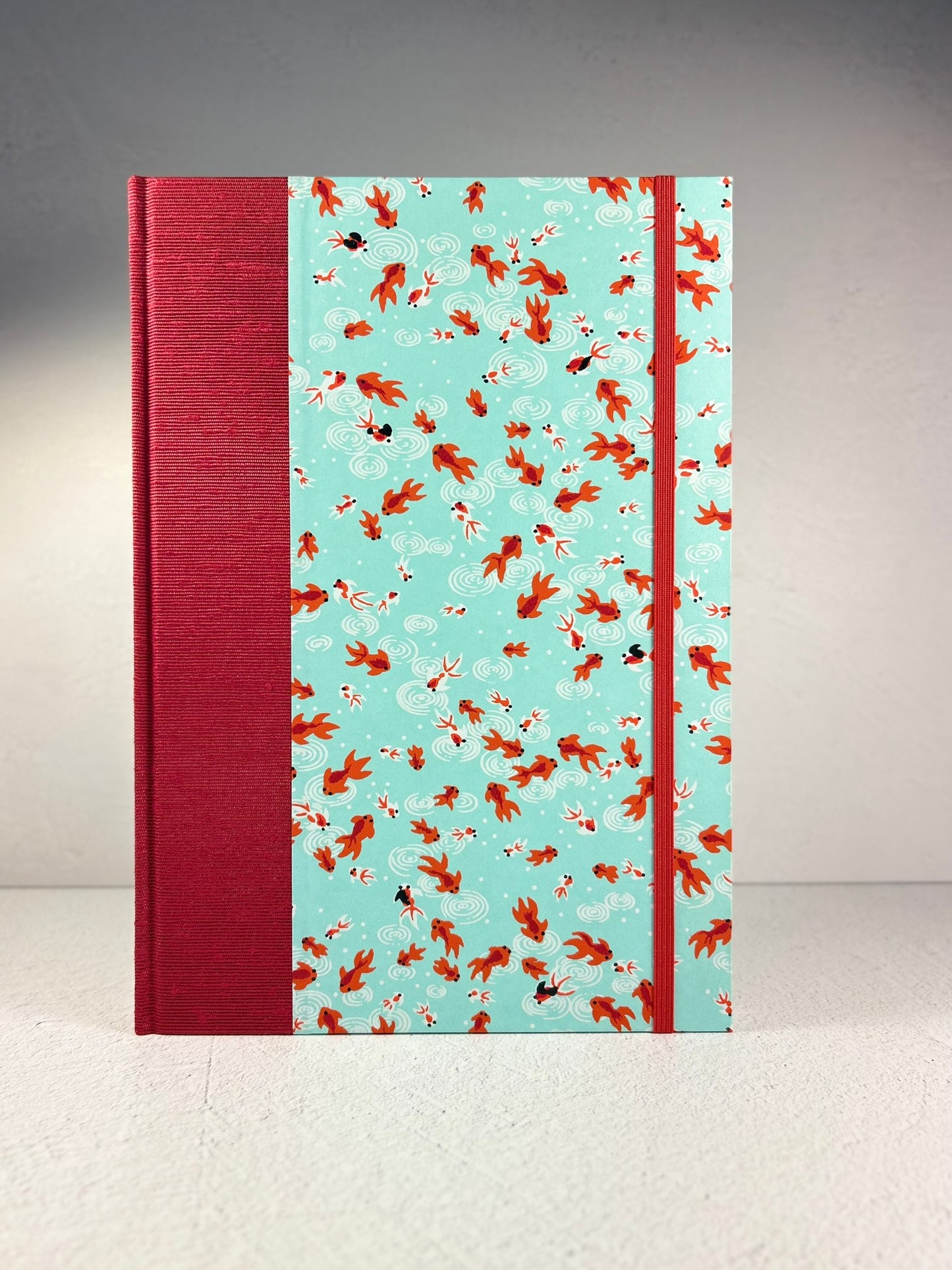 B5 Hardcover Notebook finished in Scarlet Red Japanese Bookcloth and Red/Orange Koi Fish on Aqua Chiyogami Paper
