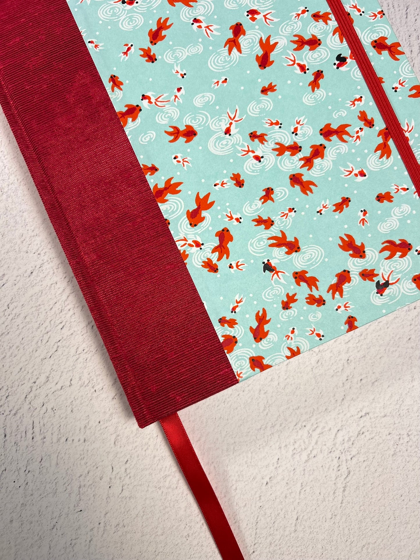 A5 Hardcover Notebook finished in Scarlet Red Japanese Bookcloth and Red/Orange Koi Fish on Aqua Chiyogami Paper