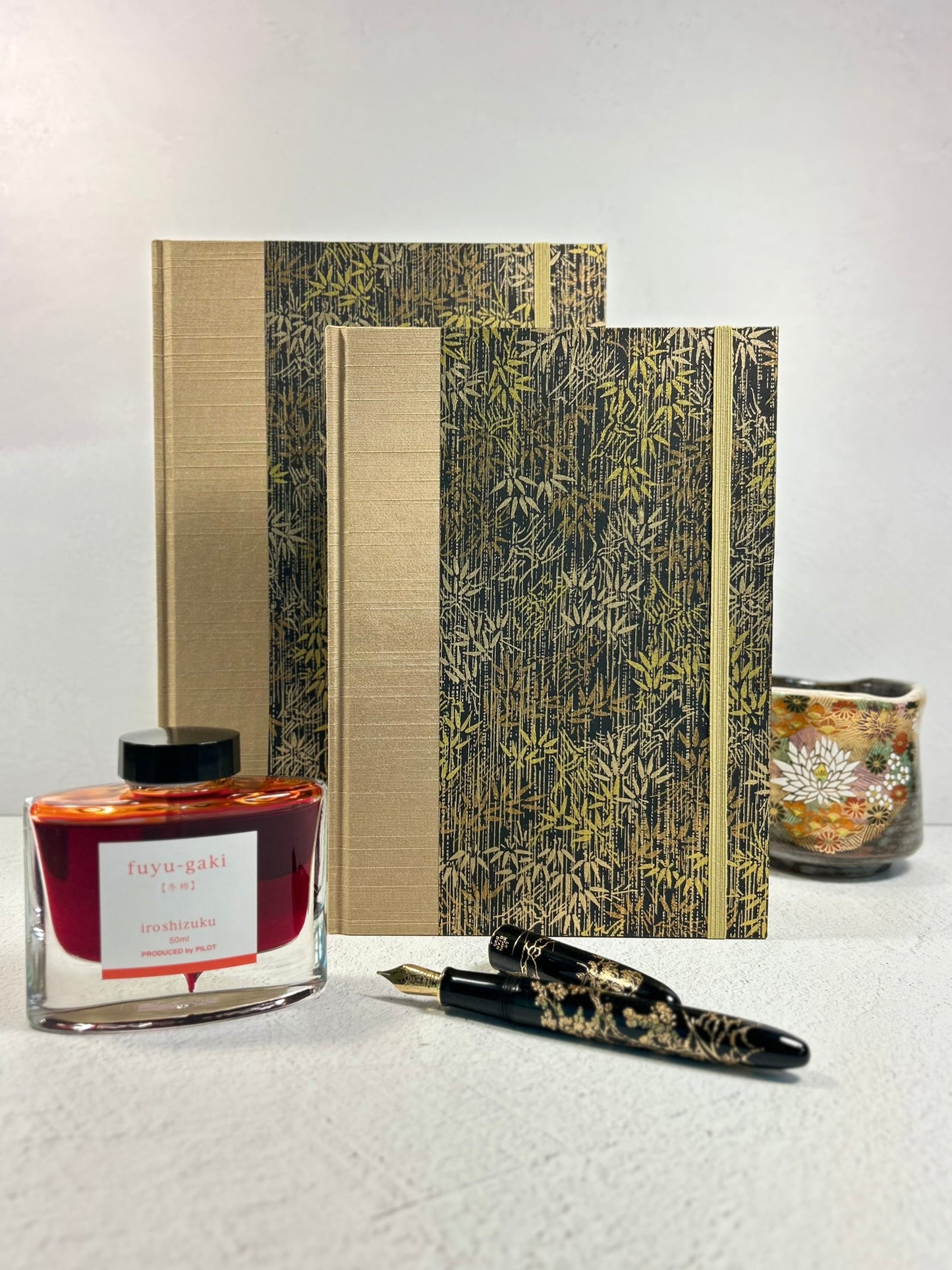 A5 Hardcover Notebook finished in soft gold Japanese Bookcloth and gold/bronze bamboo on black Chiyogami Paper