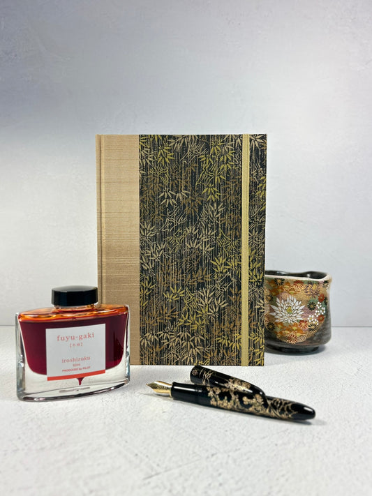 A5 Hardcover Notebook finished in soft gold Japanese Bookcloth and gold/bronze bamboo on black Chiyogami Paper