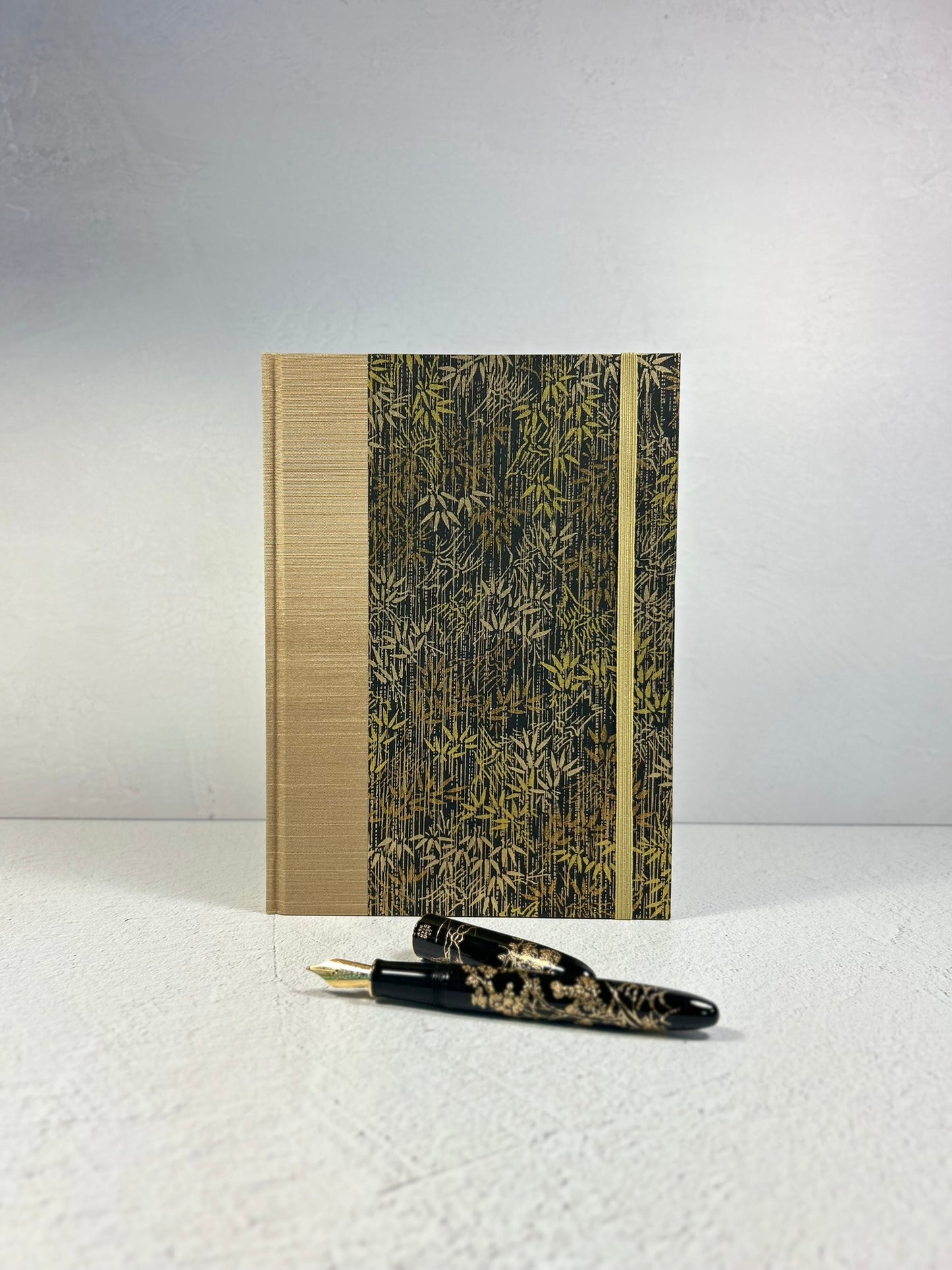 A5 Hardcover Notebook finished in soft gold Japanese Bookcloth and gold/bronze bamboo on black Chiyogami Paper