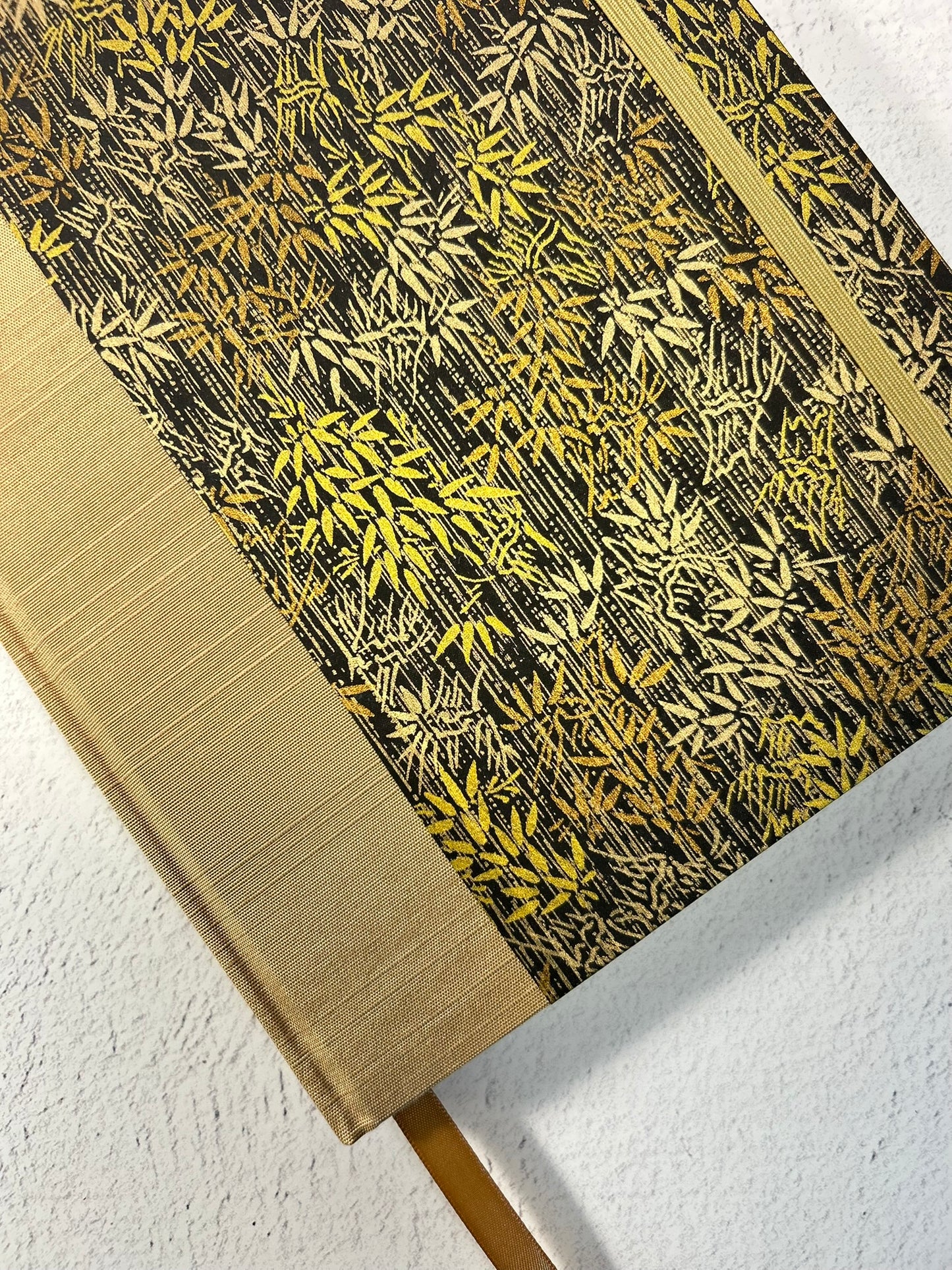 A5 Hardcover Notebook finished in soft gold Japanese Bookcloth and gold/bronze bamboo on black Chiyogami Paper