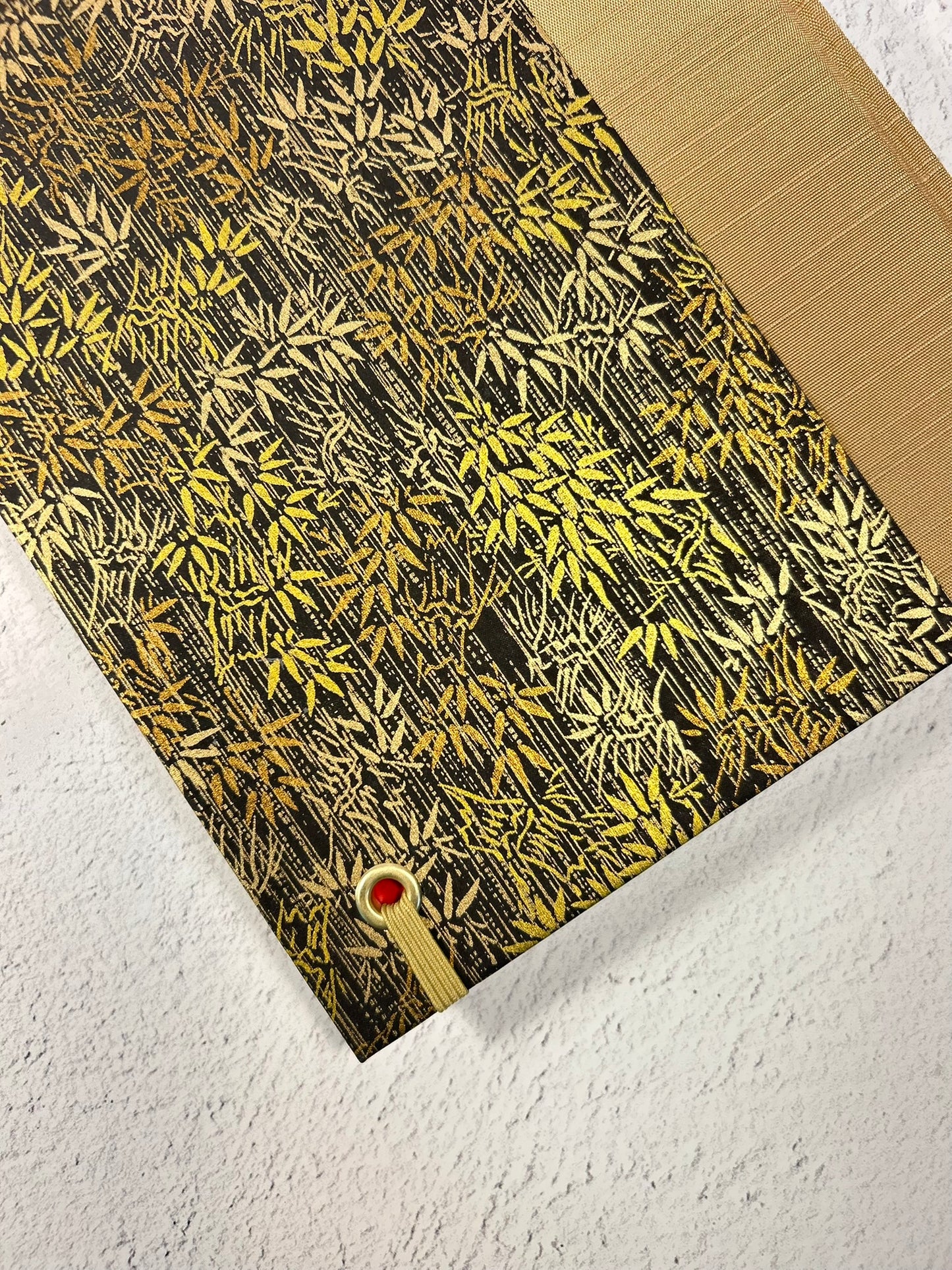 A5 Hardcover Notebook finished in soft gold Japanese Bookcloth and gold/bronze bamboo on black Chiyogami Paper