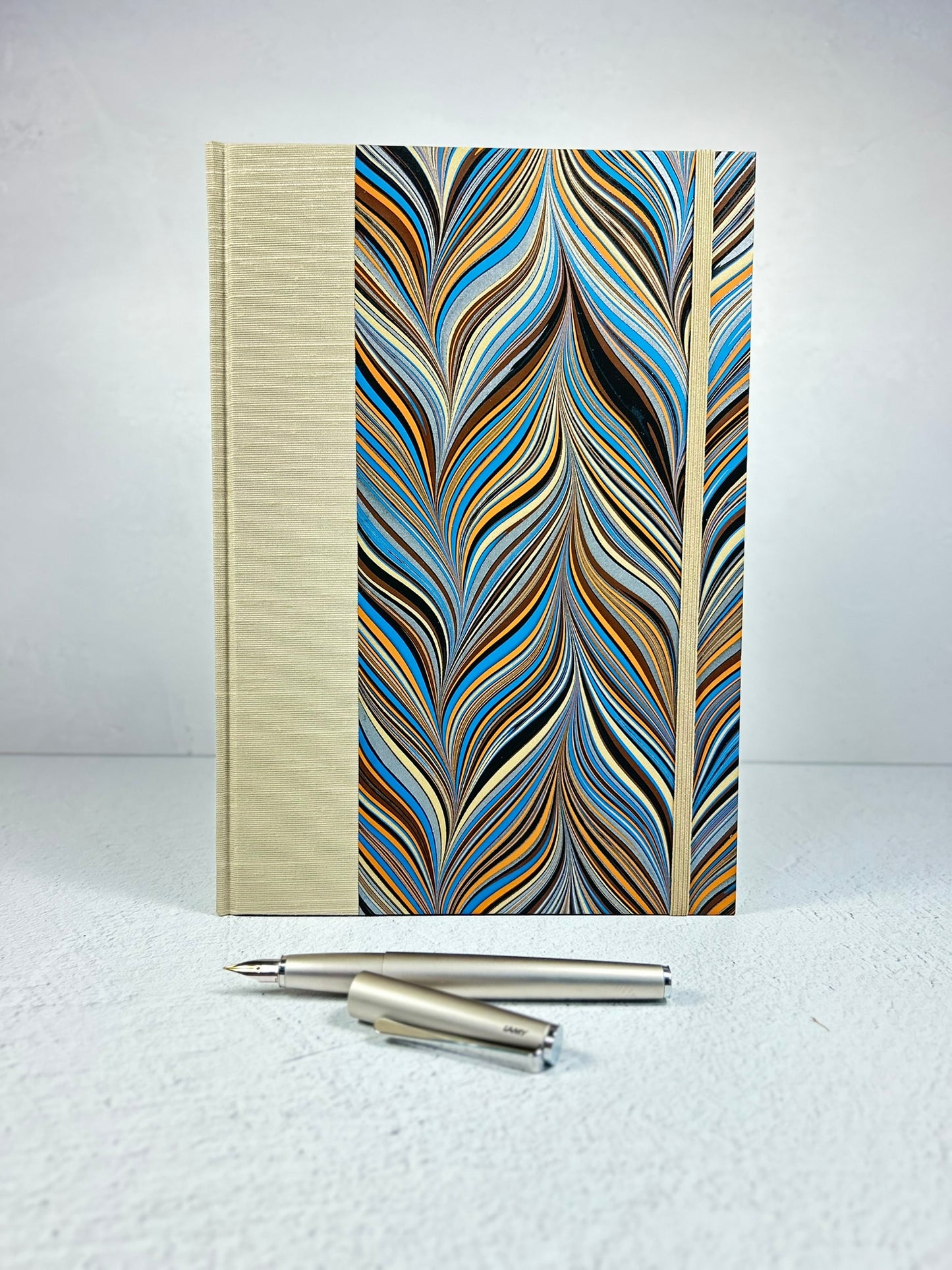 B5 Hardcover Notebook finished in Platinum Japanese book cloth and featuring Renato Crepaldi hand-marbled decorative paper