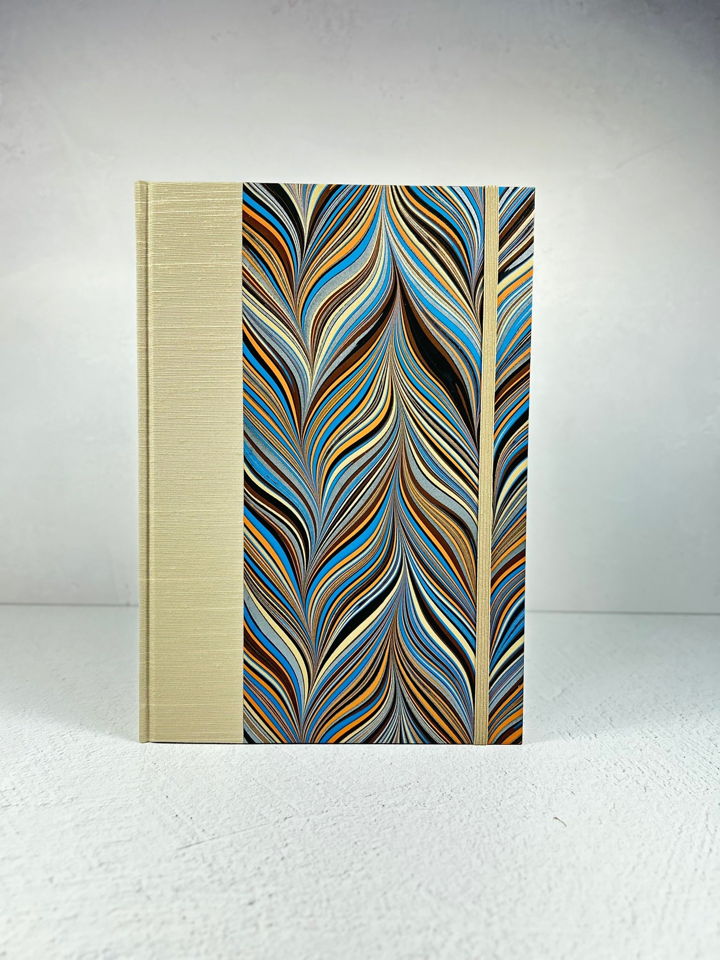 B5 Hardcover Notebook finished in Platinum Japanese book cloth and featuring Renato Crepaldi hand-marbled decorative paper