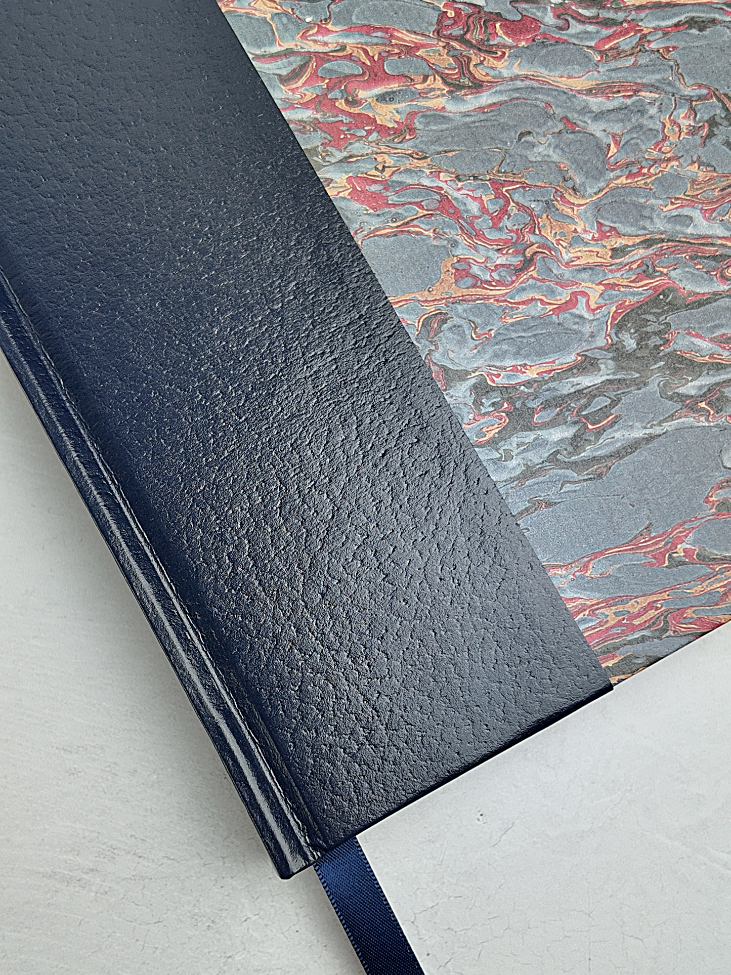 B5 192-page Hardcover Journal finished in Navy faux leather and French Marble paper