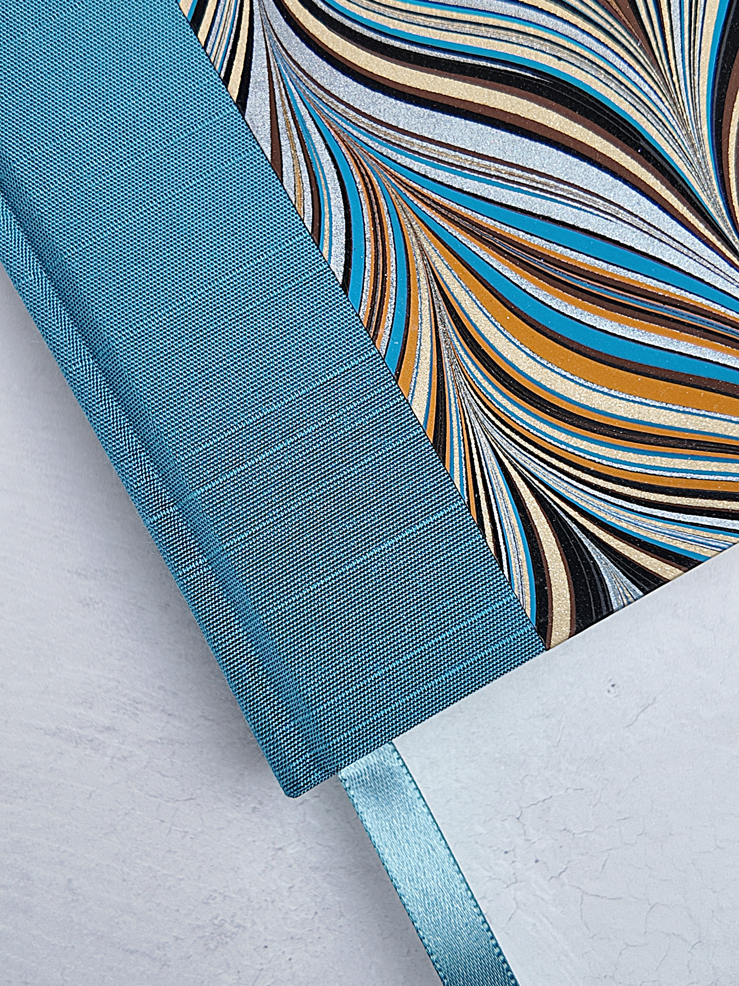 A5 160-page Hardcover Journal finished in Marine Blue Japanese book cloth and Renato Crepaldi Marble paper