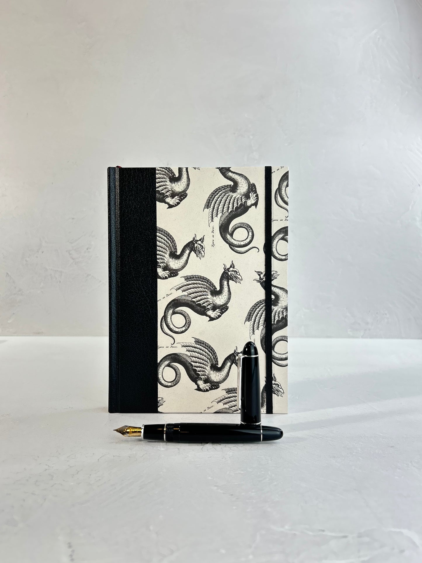 A5 160-page Hardcover Journal finished in Black Vaux Leather and Italian Letterpress dragon design