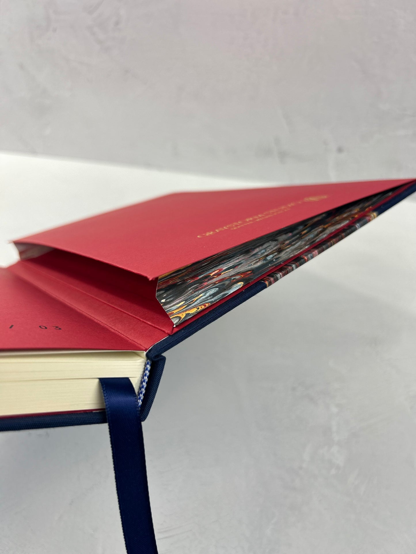 A5 160-page Hardcover Journal finished in Cadette Blue Japanese book cloth and French Marbled Paper