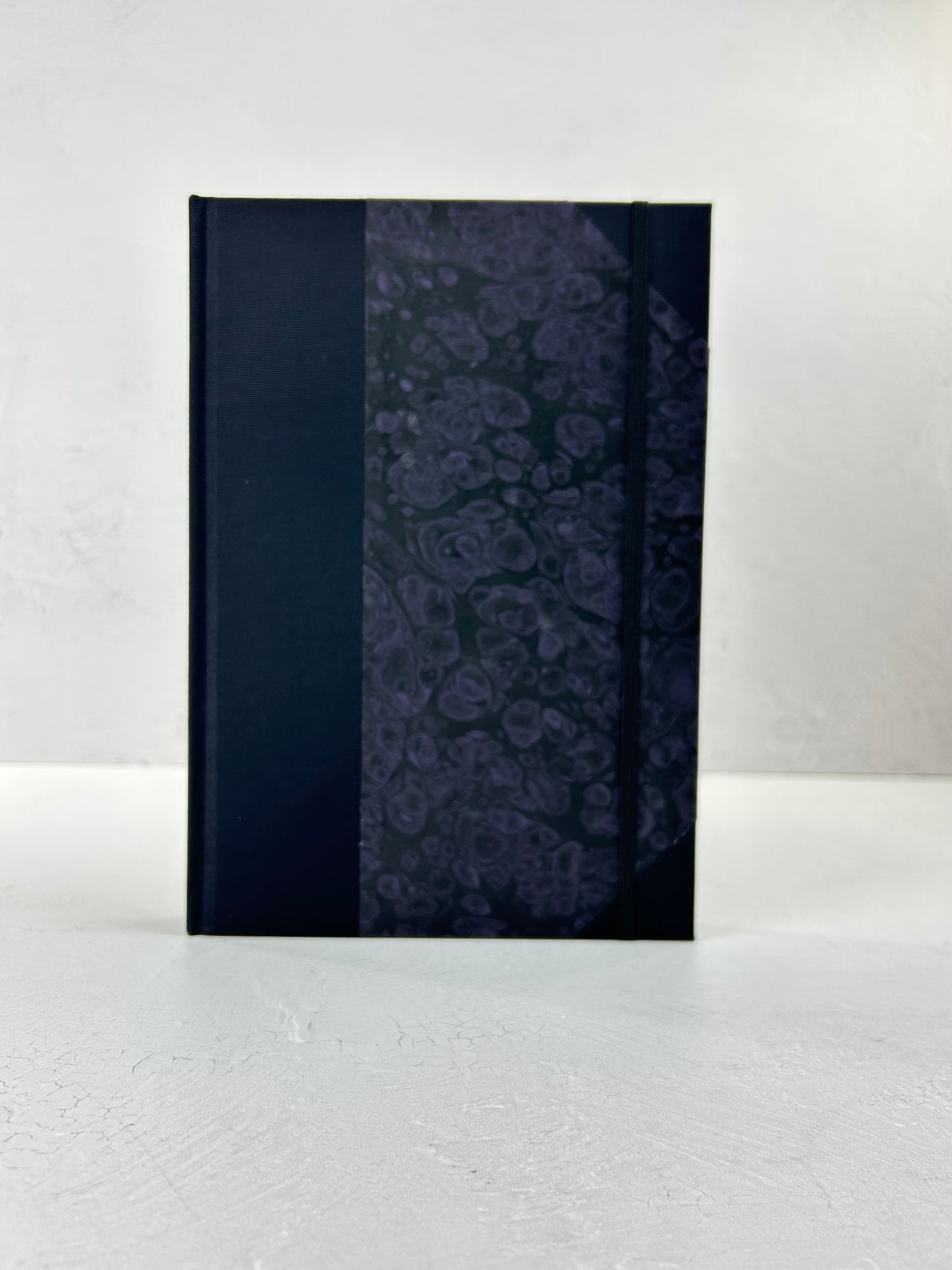 B5 192-page Hardcover Journal finished in Black Japanese book cloth and indigo hand marbled paper by Daniel Gaál