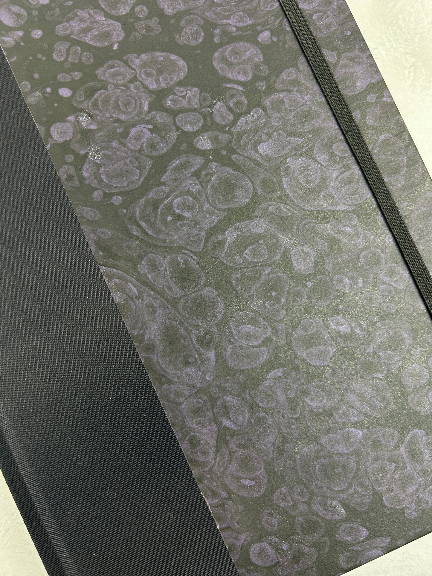 B5 192-page Hardcover Journal finished in Black Japanese book cloth and indigo hand marbled paper by Daniel Gaál