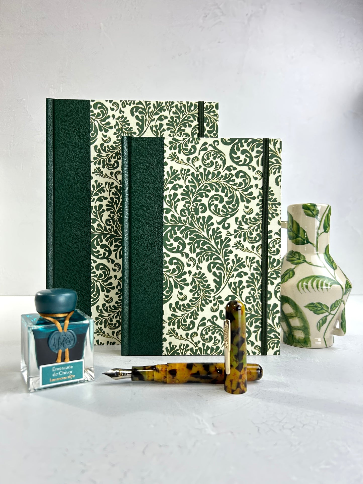 A5 160-page Hardcover Journal finished in Green Vaux Leather and green and gold fern Italian Florentine print