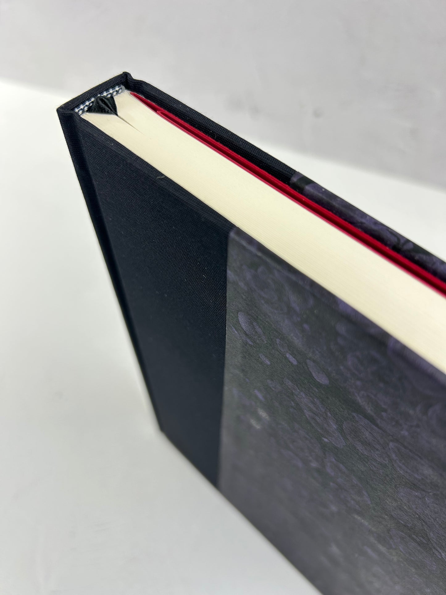 B5 192-page Hardcover Journal finished in Black Japanese book cloth and indigo hand marbled paper by Daniel Gaál