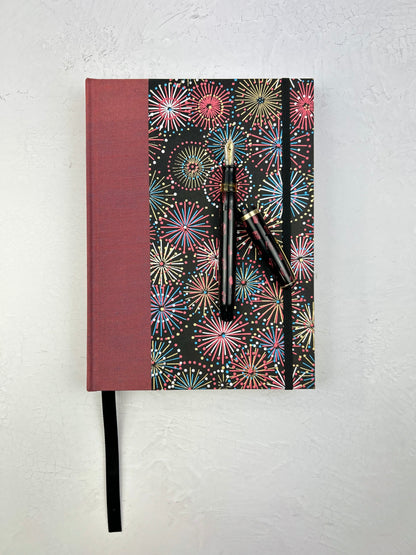 (JANUARY 2026 DELIVERY) A5 Hardcover Notebook finished in Rust Blue Japanese book cloth and Chiyogami Fireworks on Black