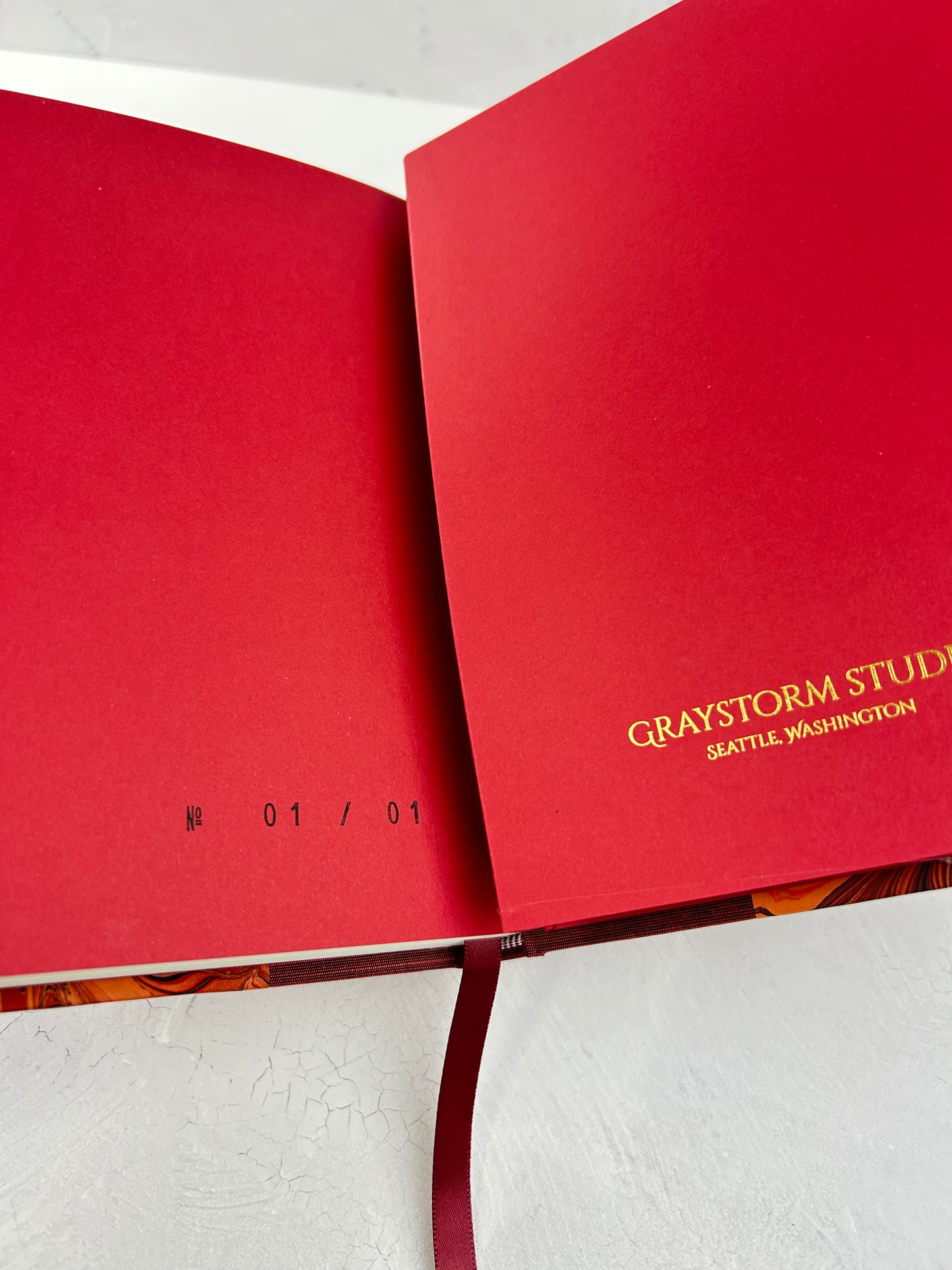 A5 160-page Hardcover Journal finished in Dark Red Japanese book cloth and hand marbled paper by Daniel Gaál