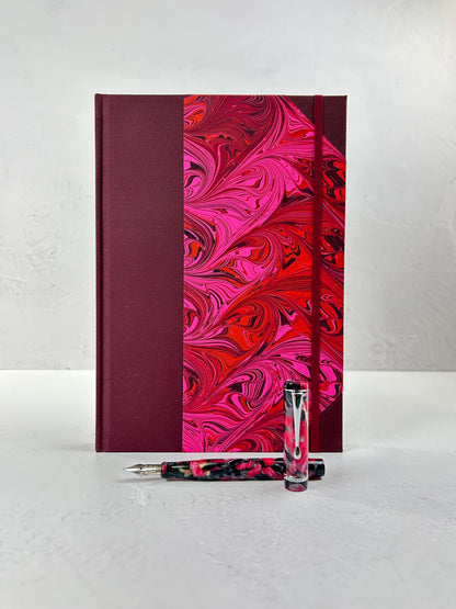 B5 192-page Hardcover Journal finished in Maroon Japanese book cloth and red/pink hand marbled paper by Daniel Gaál
