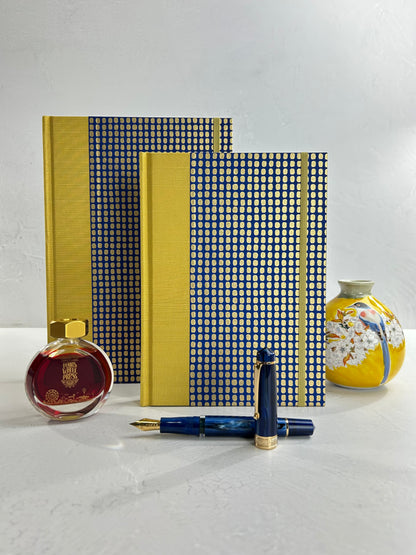 A5 160-page Hardcover Journal finished in Yellow Gold Japanese book cloth and blue and gold Chiyogami Paper