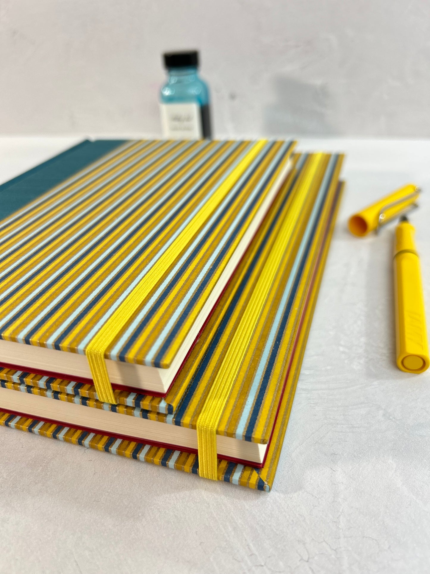 A5 160-page Hardcover Journal finished in Marine Blue Japanese book cloth and pinstripe Chiyogami Paper