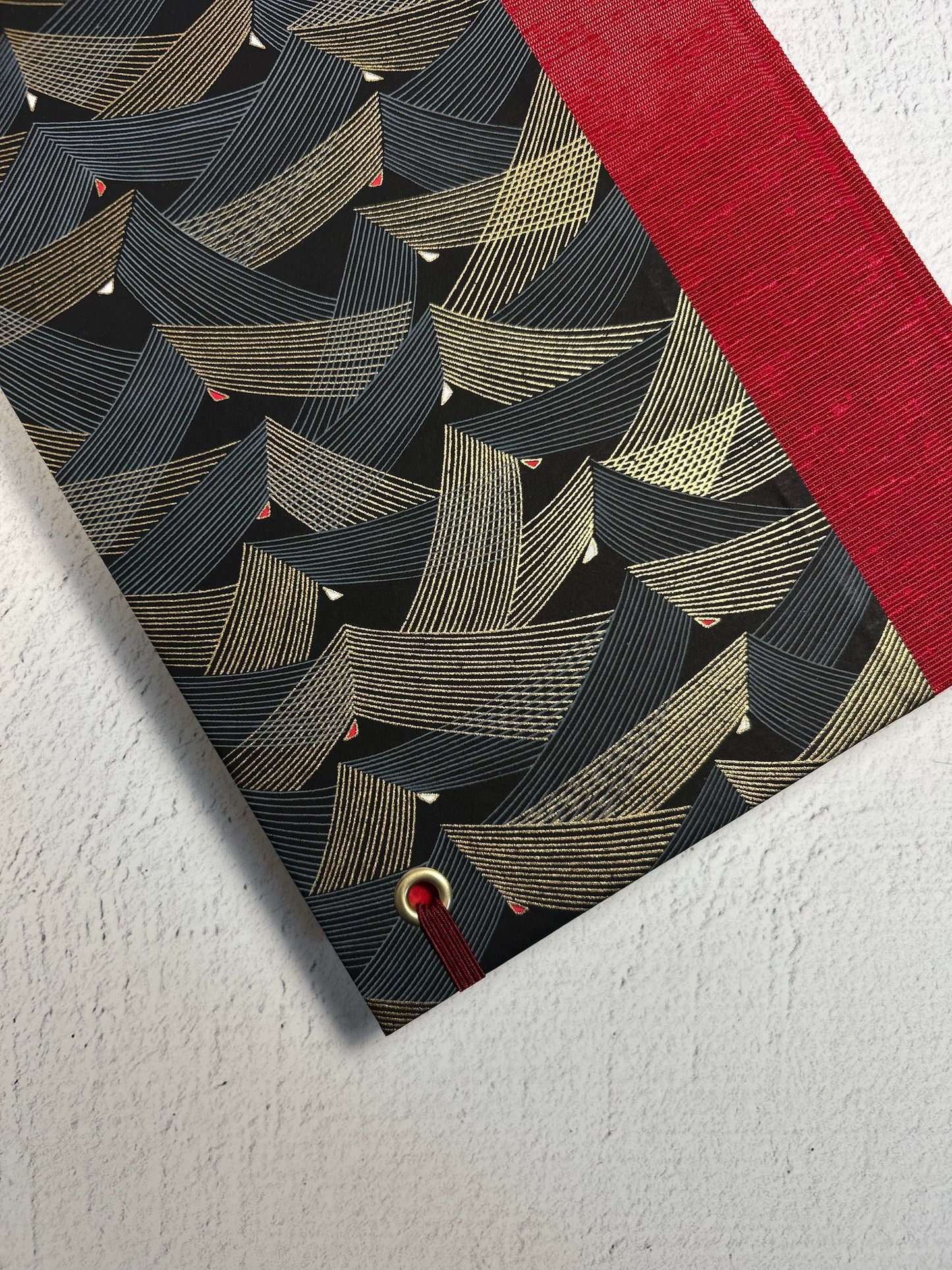 A5 160-page Hardcover Hardcover Notebook finished in Cardinal Red Japanese Bookcloth and Black and Gold Chiyogami Japanese Paper