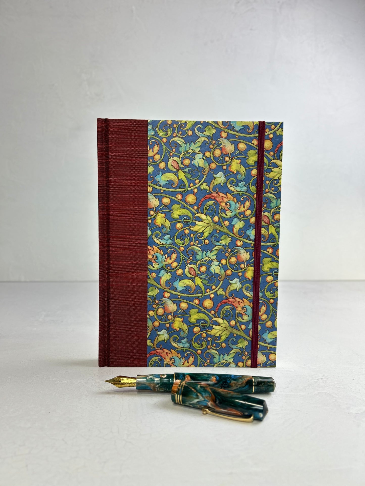 A5 160-page Hardcover Journal finished in Dark Red Japanese book cloth and Floral Italian Florentine Paper