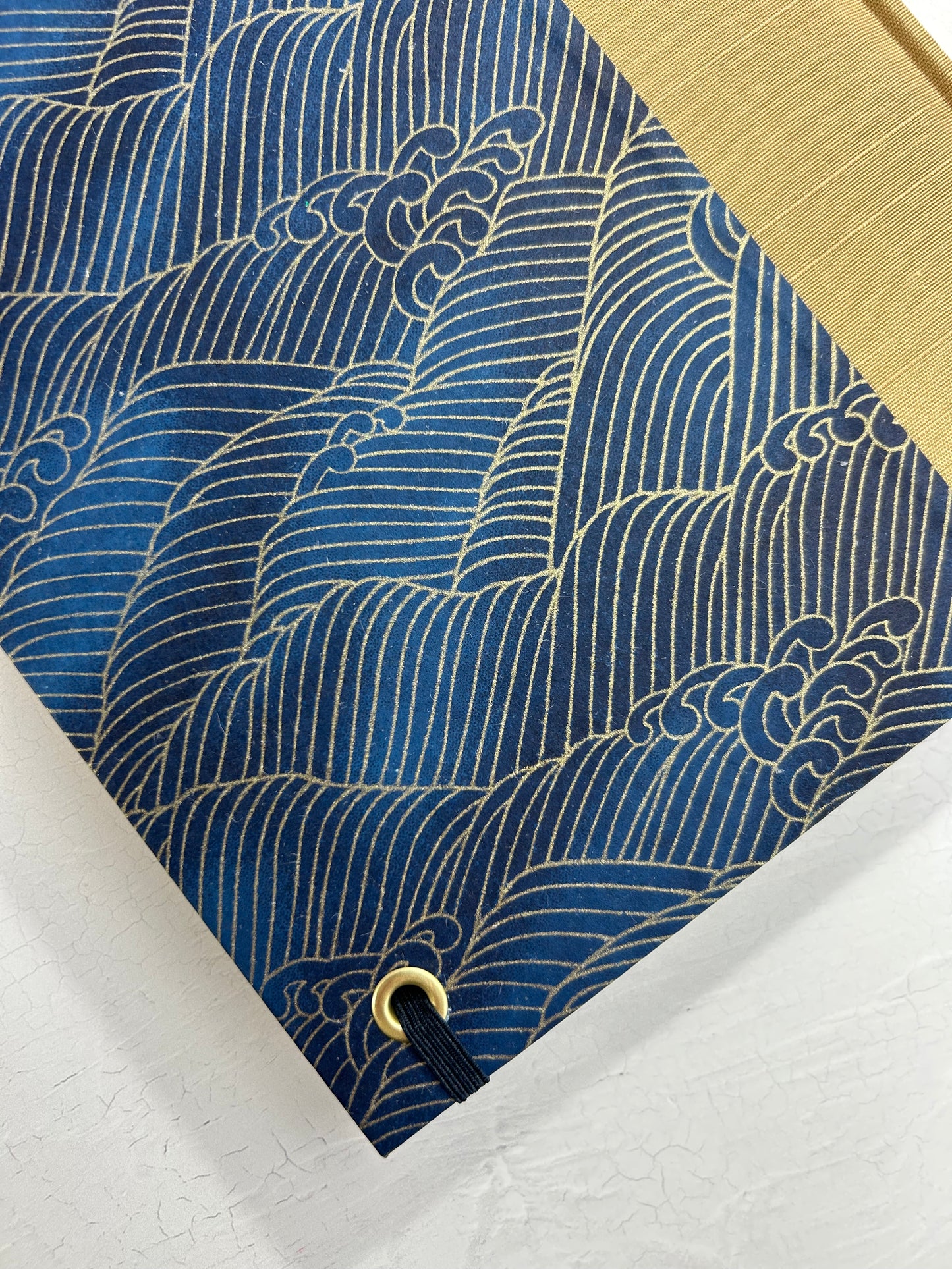 A5 160-page Hardcover Journal finished in soft gold Japanese book cloth and golden waves on blue Chiyogami Paper