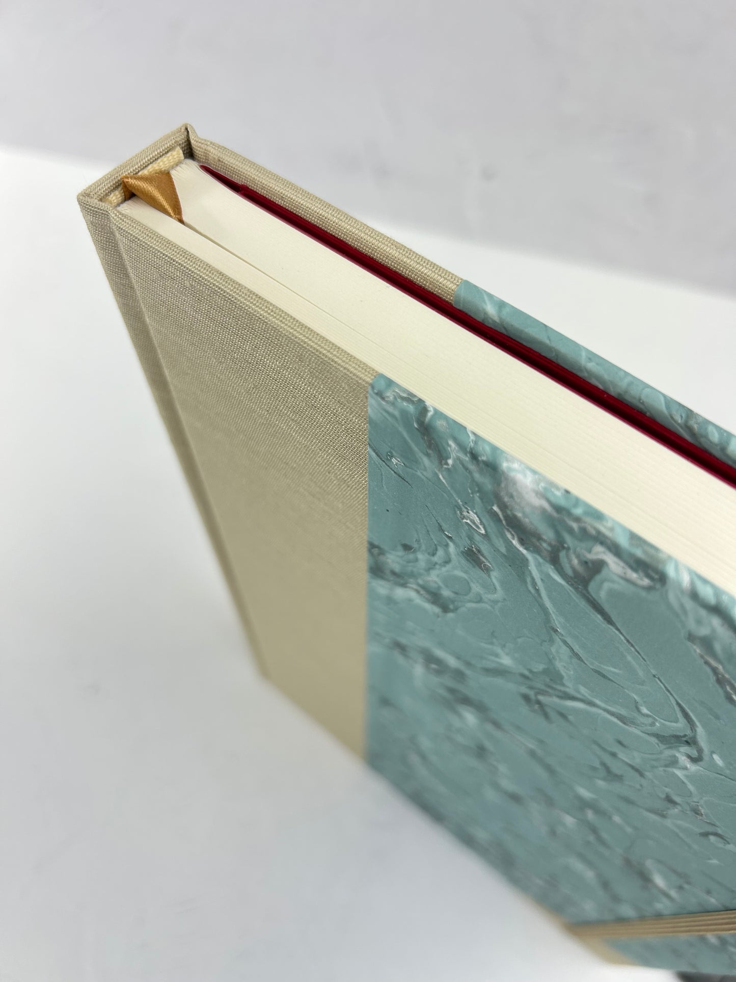 A5 160-page Hardcover Journal finished in Platinum Japanese book cloth and light blue French Marble Paper