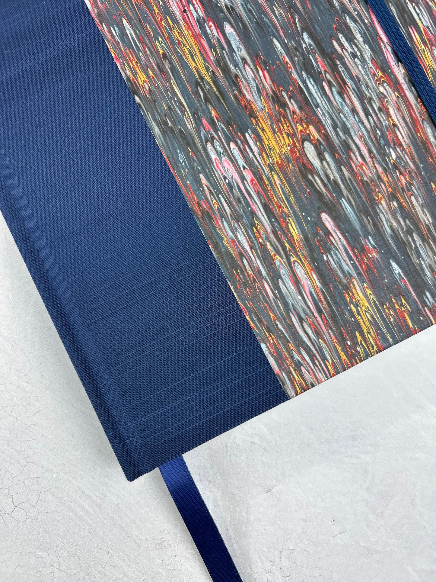 A5 160-page Hardcover Journal finished in Cadette Blue Japanese book cloth and French Marbled Paper