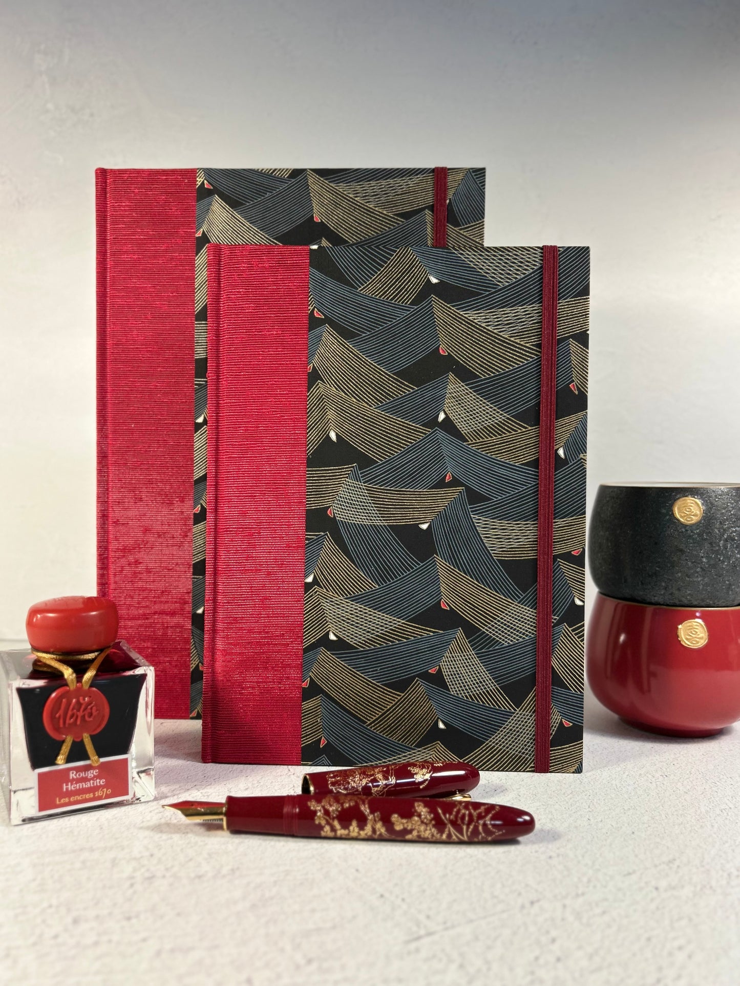 A5 160-page Hardcover Hardcover Notebook finished in Cardinal Red Japanese Bookcloth and Black and Gold Chiyogami Japanese Paper