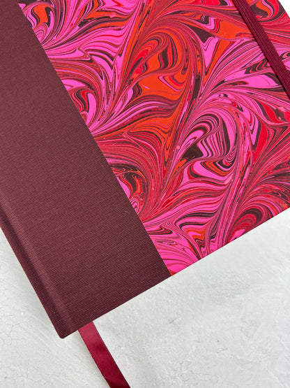 B5 192-page Hardcover Journal finished in Maroon Japanese book cloth and red/pink hand marbled paper by Daniel Gaál