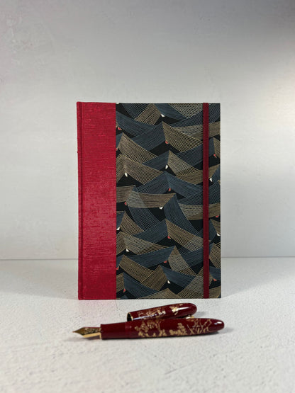 A5 160-page Hardcover Hardcover Notebook finished in Cardinal Red Japanese Bookcloth and Black and Gold Chiyogami Japanese Paper
