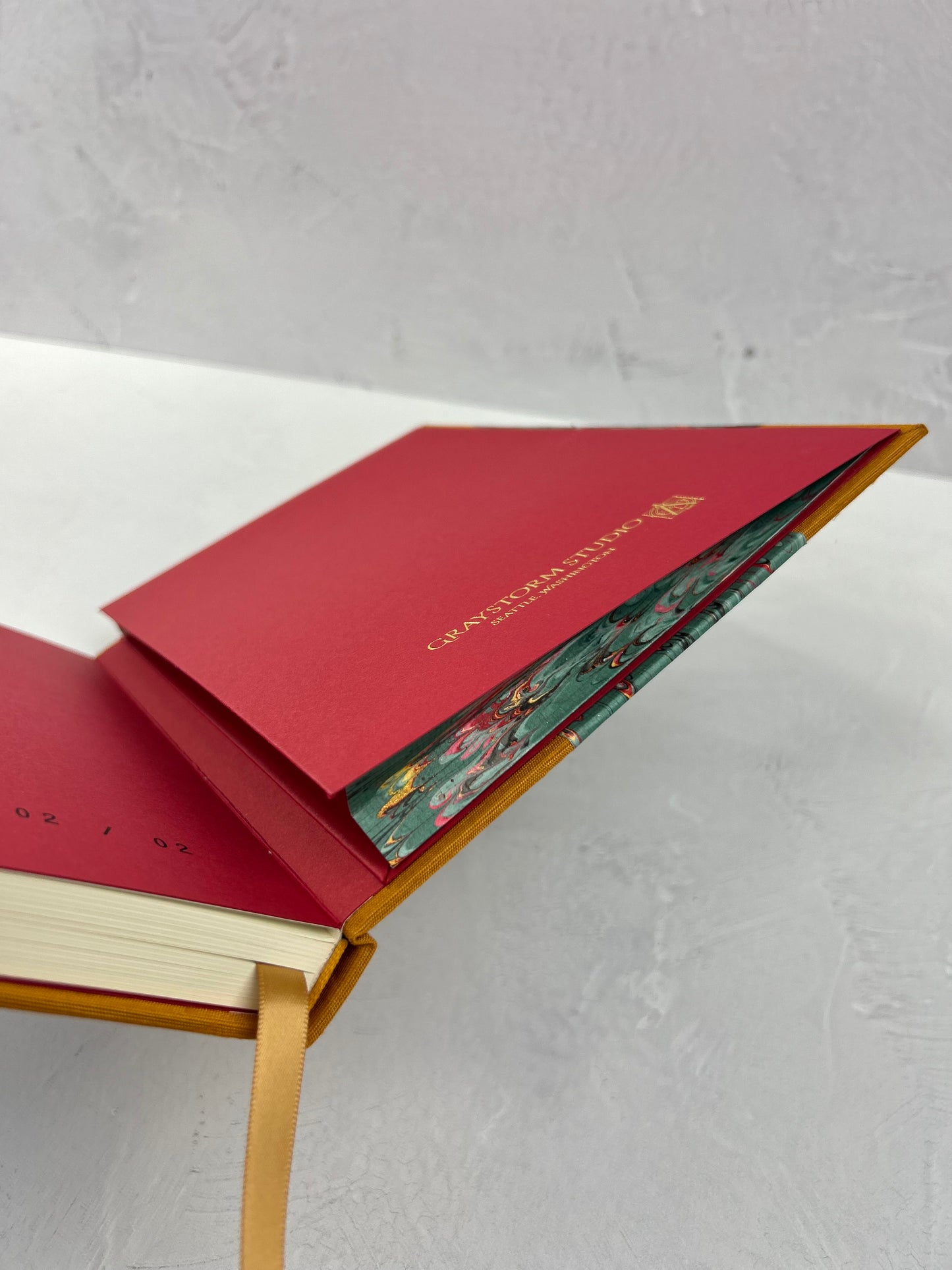 B5 192-page Hardcover Journal finished in Ochre Japanese book cloth and green French Marble Paper