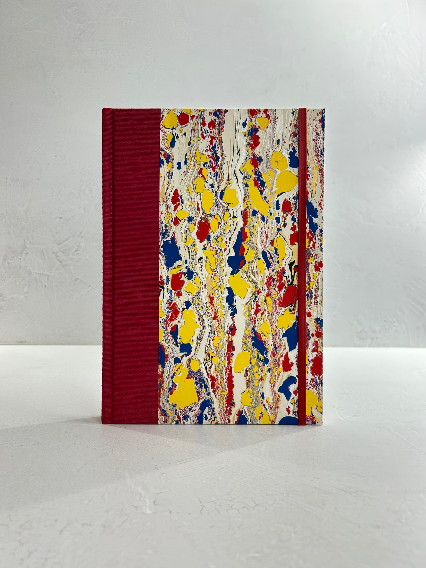 B5 192-page Hardcover Journal finished in Cardinal Red Japanese book cloth and Italian hand-marbled paper by Renato Crepaldi