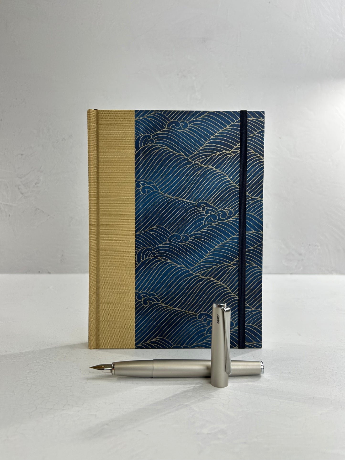 A5 160-page Hardcover Journal finished in soft gold Japanese book cloth and golden waves on blue Chiyogami Paper
