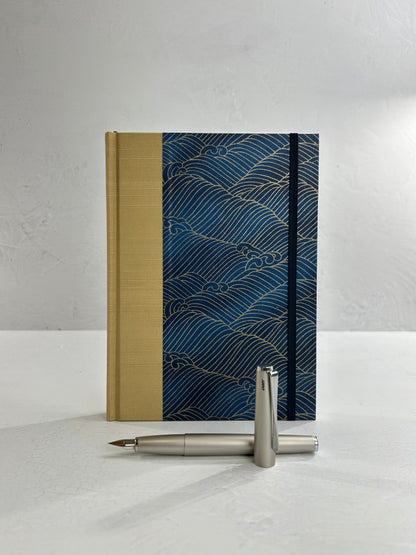 A5 160-page Hardcover Journal finished in soft gold Japanese book cloth and golden waves on blue Chiyogami Paper