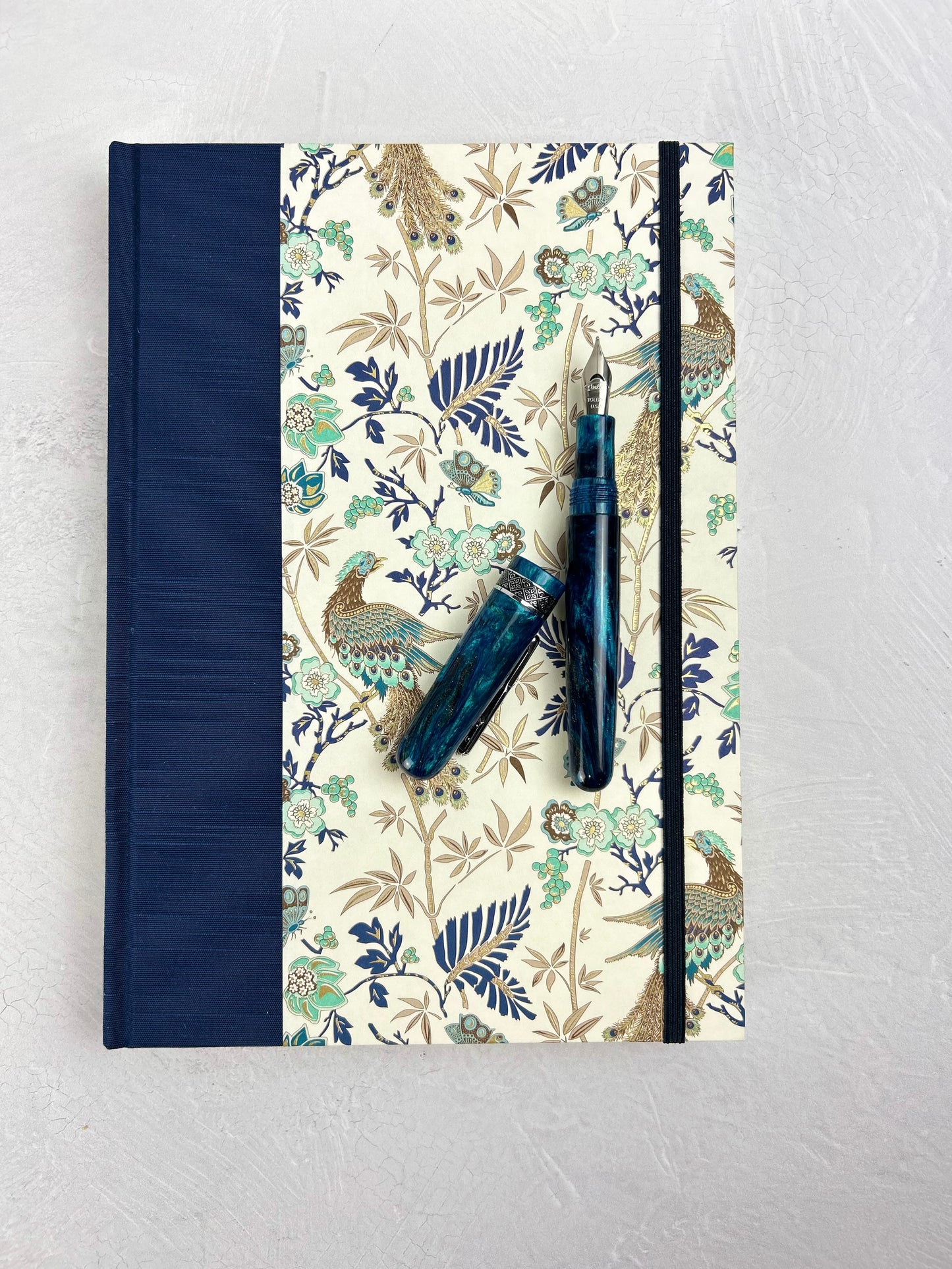B5 Hardcover Notebook finished in Cadette Blue Japanese book cloth and Gold Peacock Italian Print