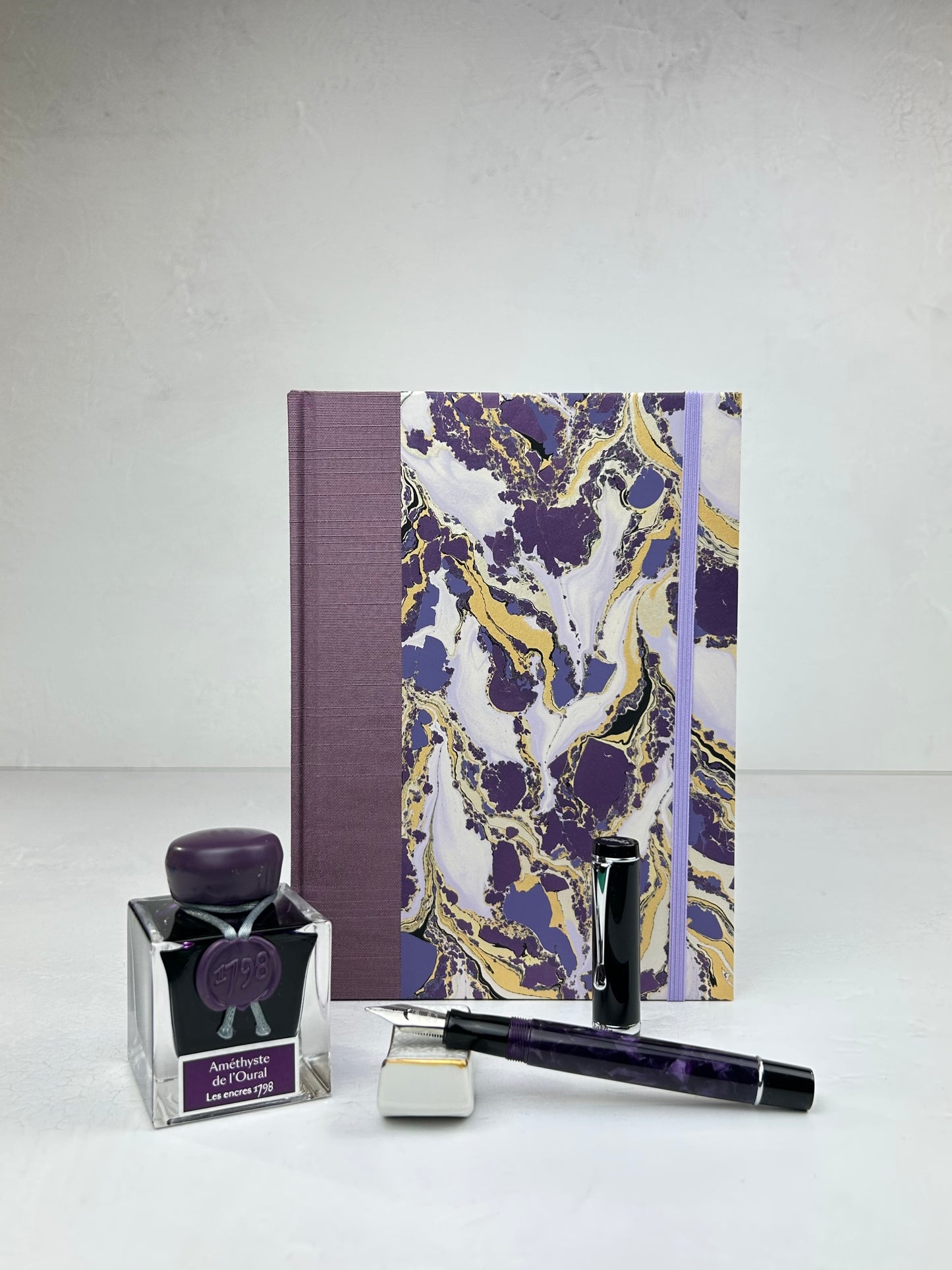 A5 160-page Hardcover Journal finished in plum Japanese book cloth and hand marbled paper by Renato Crepaldi