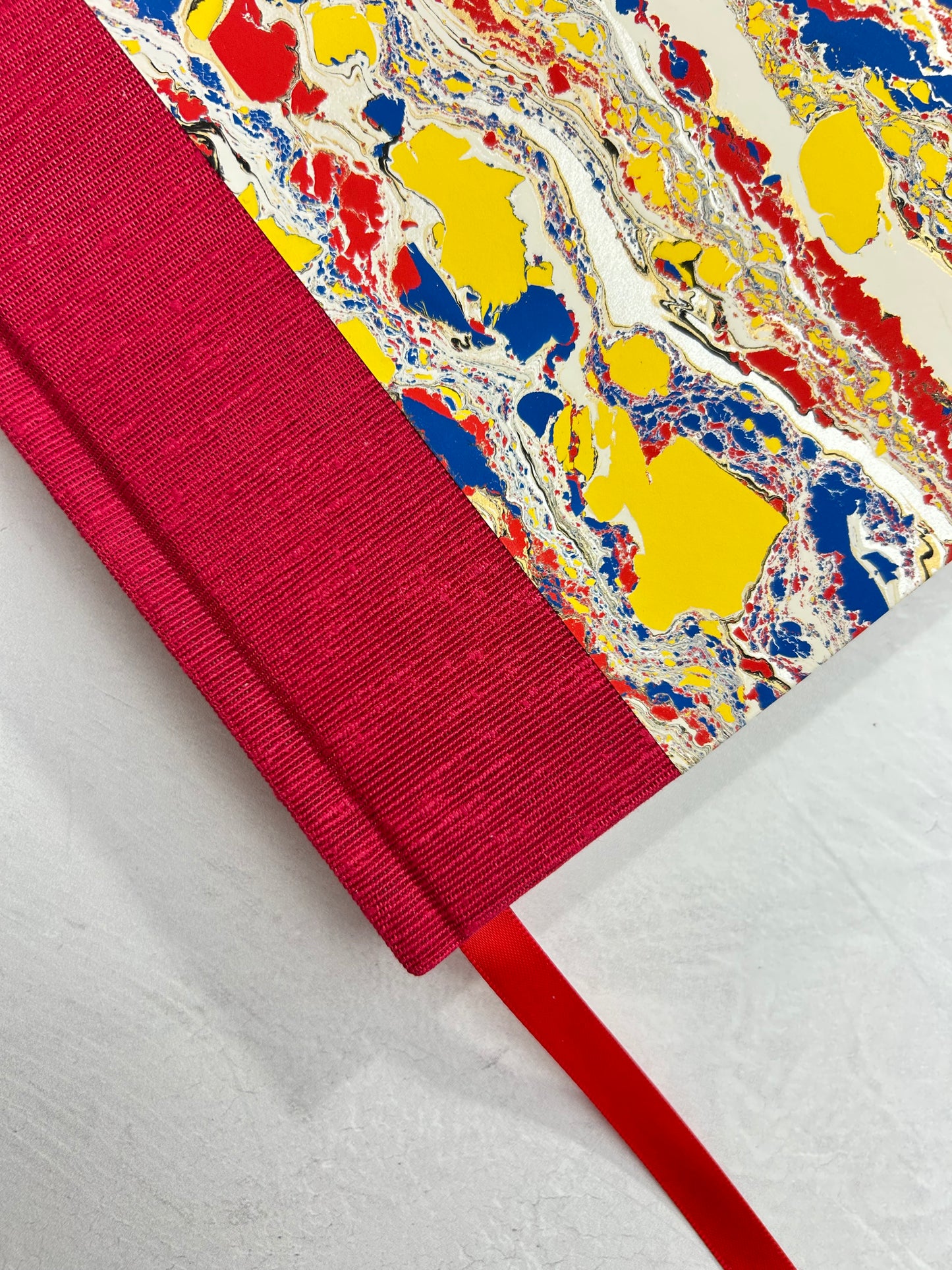 B5 192-page Hardcover Journal finished in Cardinal Red Japanese book cloth and Italian hand-marbled paper by Renato Crepaldi