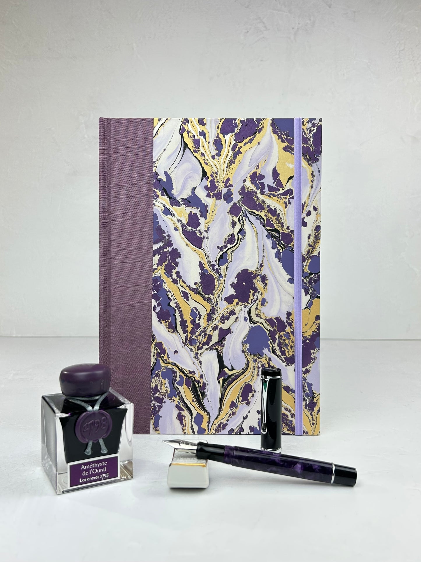 B5 192-page Hardcover Journal finished in plum Japanese book cloth and hand marbled paper by Renato Crepaldi