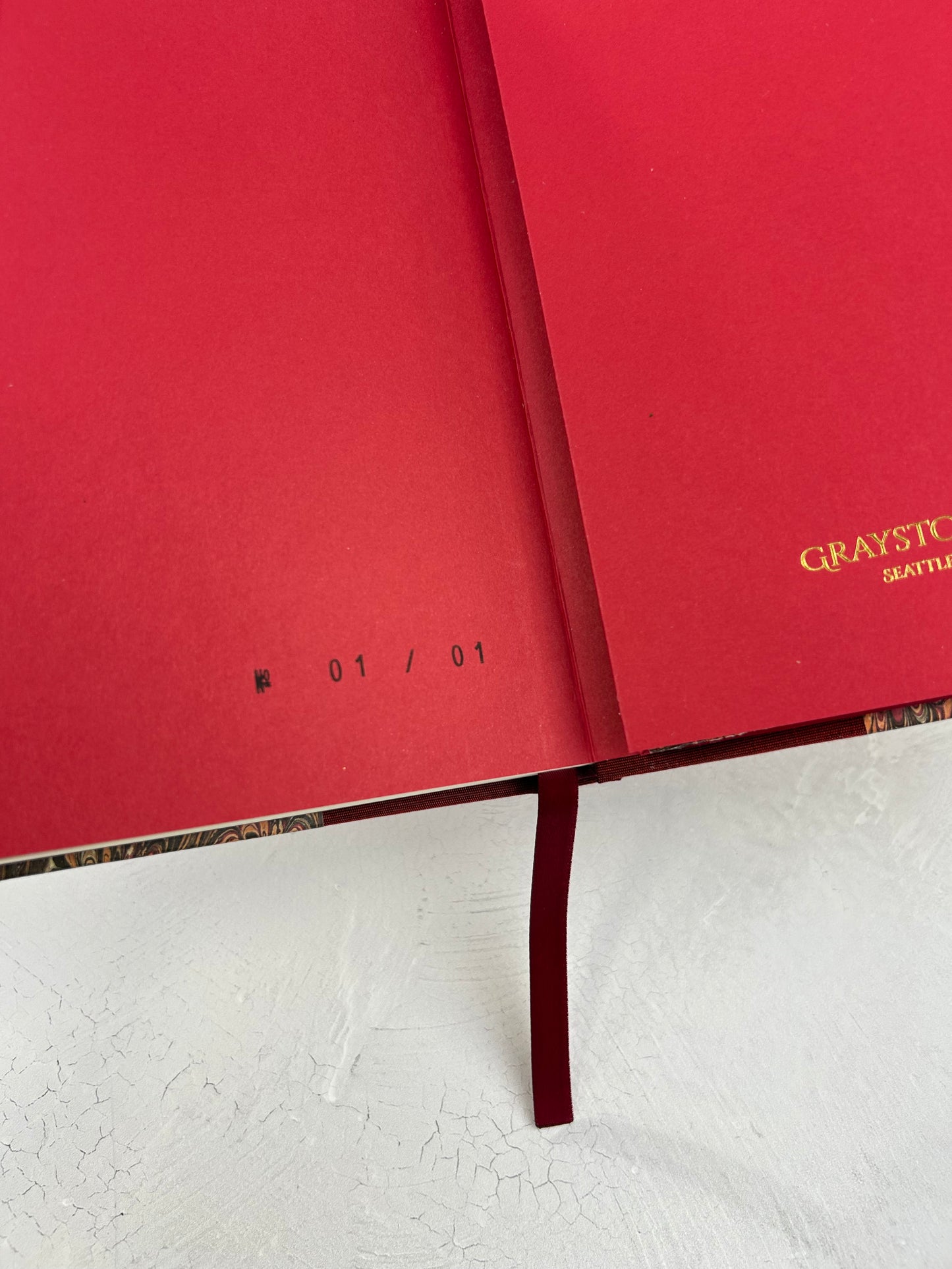 B5 192-page Hardcover Journal finished in Maroon Japanese book cloth and wine/black French Marbled Paper