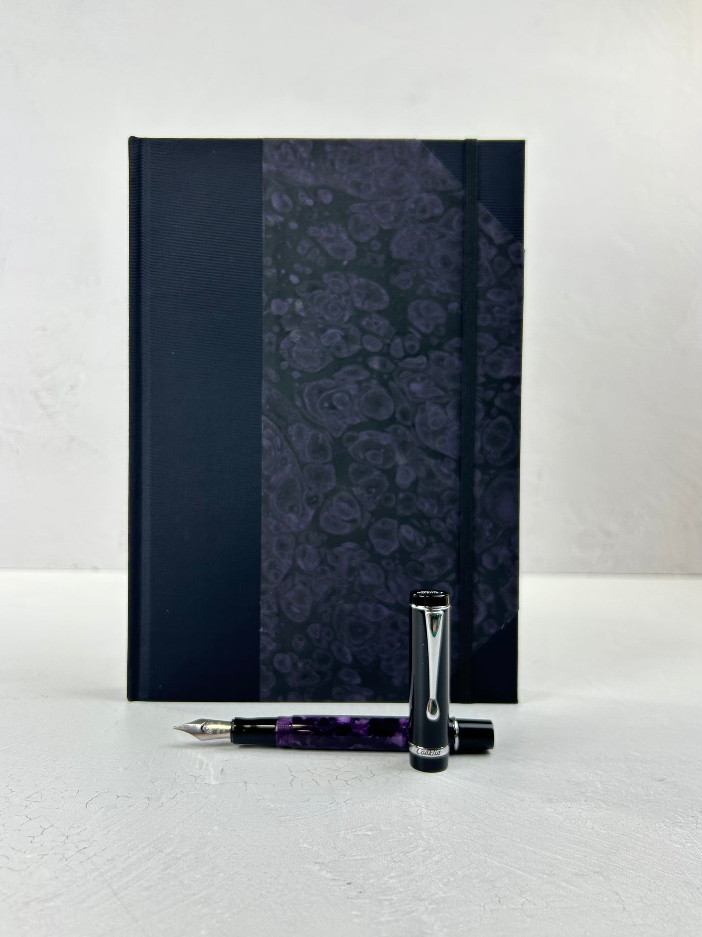 B5 192-page Hardcover Journal finished in Black Japanese book cloth and indigo hand marbled paper by Daniel Gaál