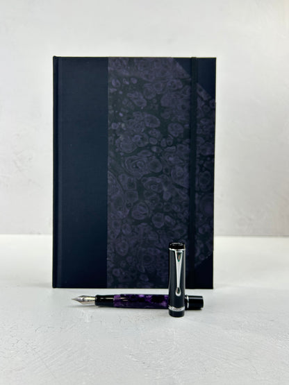 B5 192-page Hardcover Journal finished in Black Japanese book cloth and indigo hand marbled paper by Daniel Gaál