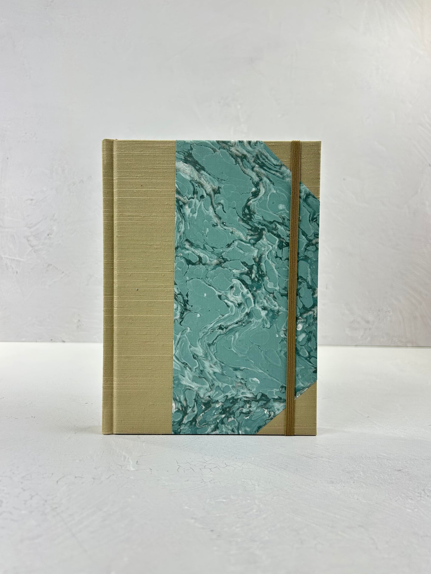 A5 160-page Hardcover Journal finished in Platinum Japanese book cloth and light blue French Marble Paper