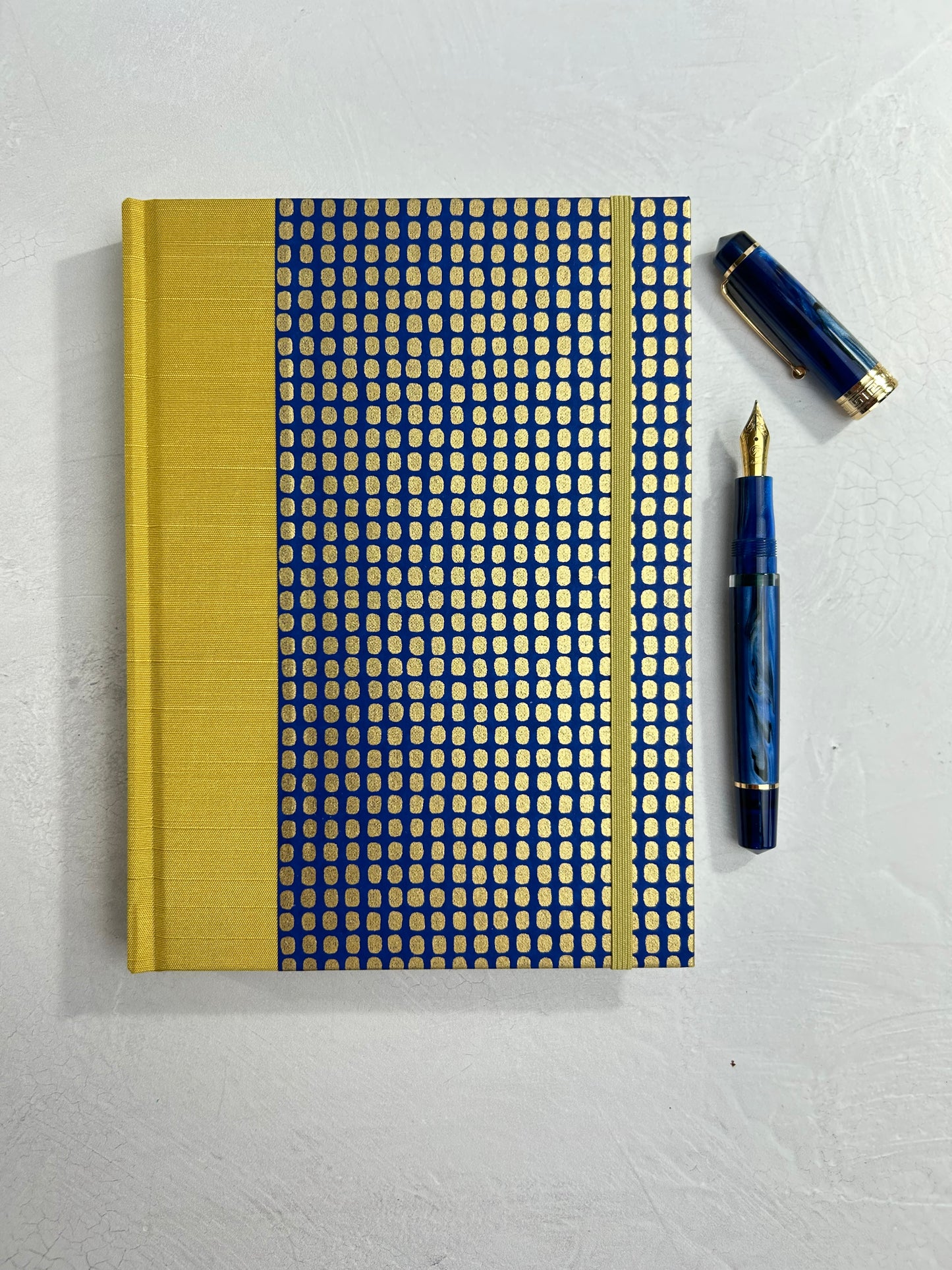 A5 160-page Hardcover Journal finished in Yellow Gold Japanese book cloth and blue and gold Chiyogami Paper