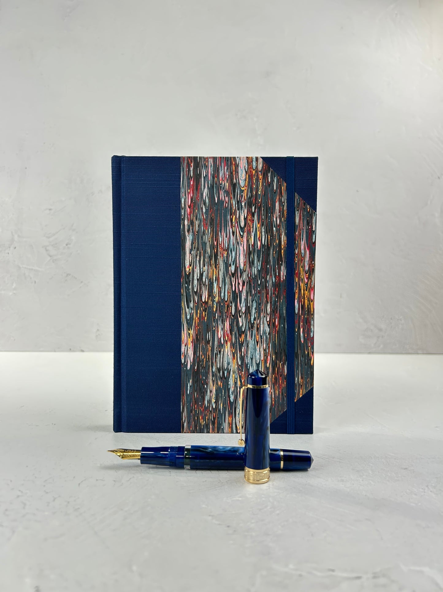 A5 160-page Hardcover Journal finished in Cadette Blue Japanese book cloth and French Marbled Paper