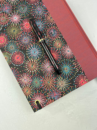 (JANUARY 2026 DELIVERY) B5 Hardcover Notebook finished in Rust Blue Japanese book cloth and Chiyogami Fireworks on Black