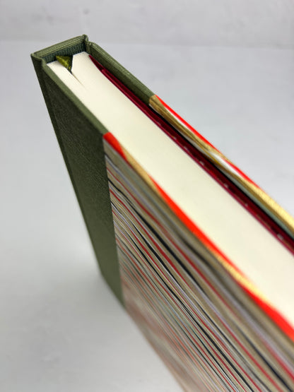 A5 160-page Hardcover Journal finished in olive green Japanese book cloth and gold, black and red geometric Chiyogami Paper