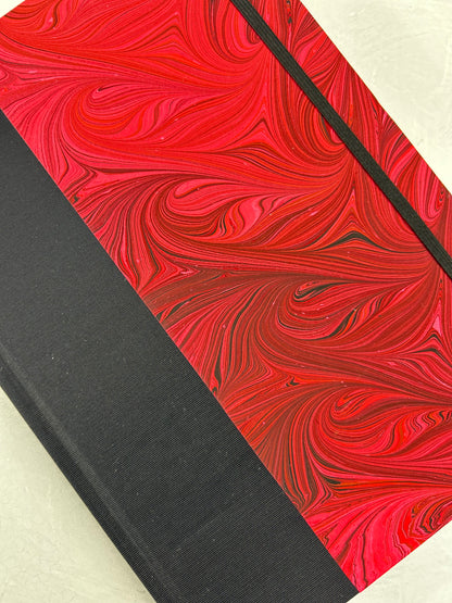 B5 192-page Hardcover Journal finished in Black Japanese book cloth and red hand marbled paper by Daniel Gaál